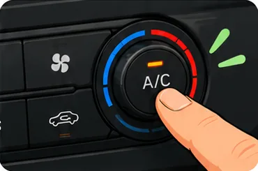 Finger pressing the A/C button on a car dashboard