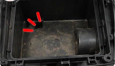 Clean side of the airbox covered in dust